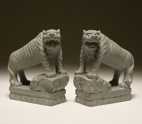 Appraisal: Pair of Indian hand carved stone tigers with open snarling