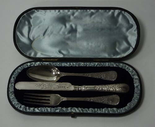 Appraisal: A three-piece silver Christening set Edward Hutton London comprising knife