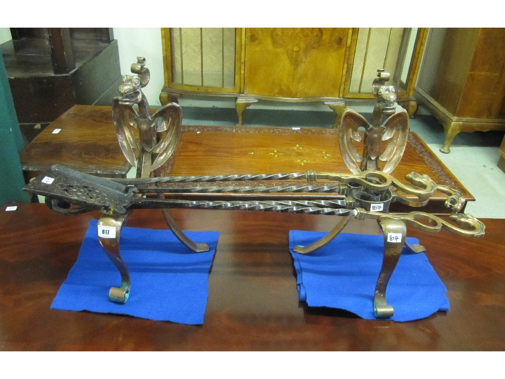 Appraisal: Pair of Art Nouveau style copper fire dogs with irons