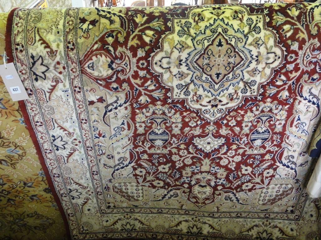 Appraisal: A Middle Eastern carpet with a central lozenge on a