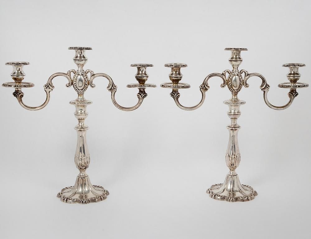 Appraisal: PAIR OF STERLING SILVER THREE-SOCLE CANDELABRUM th Century Maker's mark