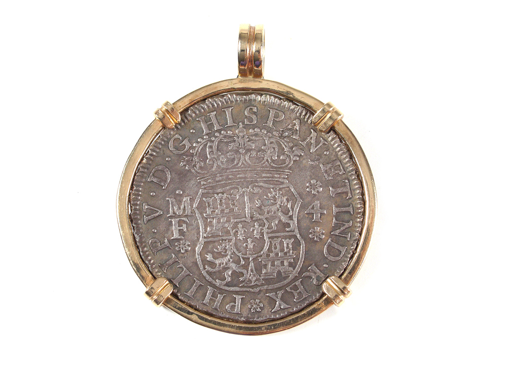 Appraisal: MEXICAN REALES SILVER COIN Mounted in a k gold bezel