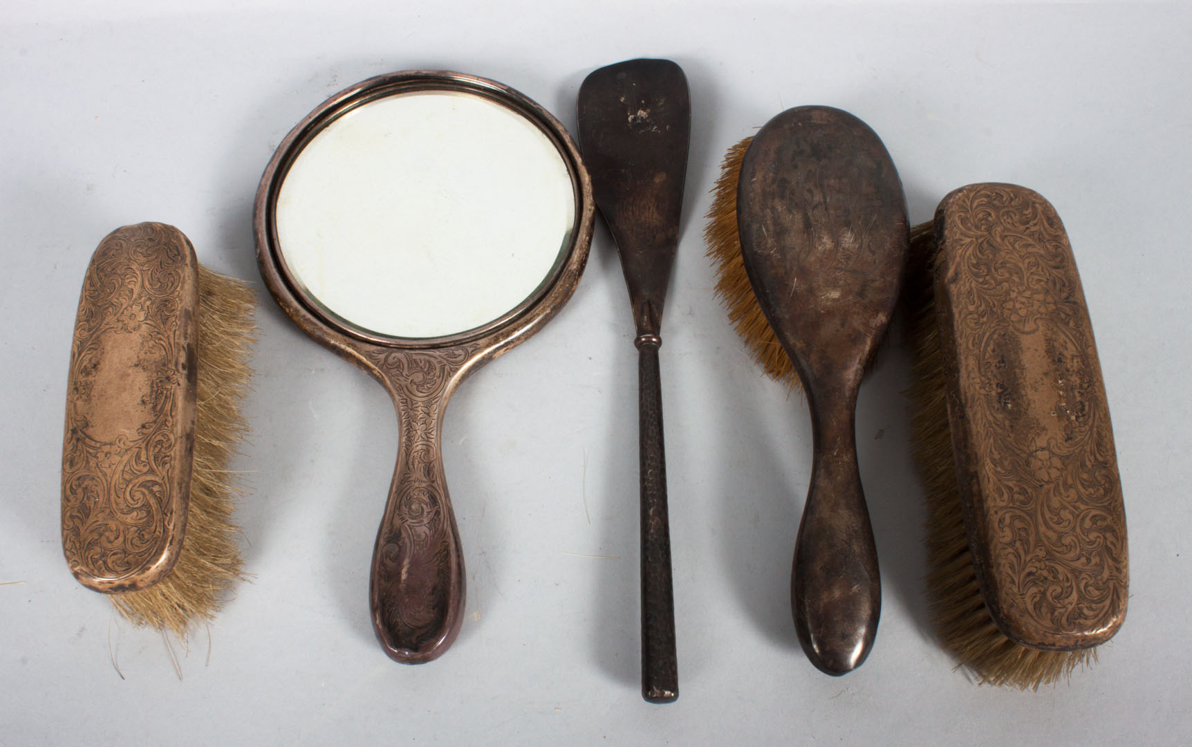 Appraisal: Three-piece sterling handled dresser set together with a similar brush