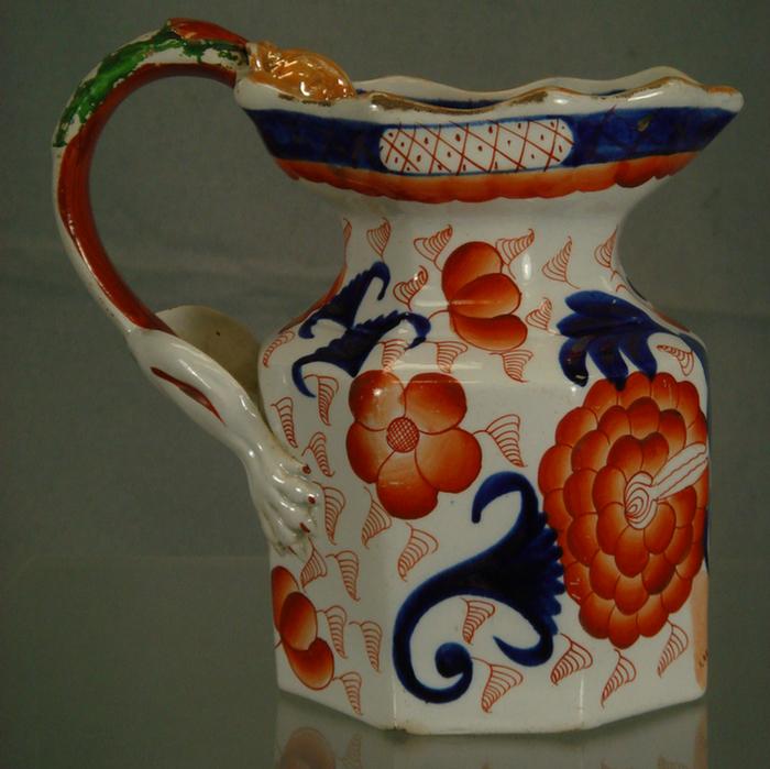 Appraisal: Ironstone China Imari palette peony design pitcher footed figural handle