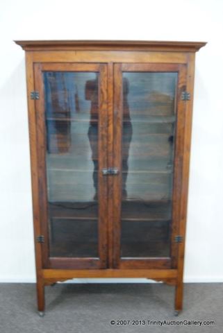 Appraisal: Antique Mahogany Curio Cupboard on CastersFrom an estate is a