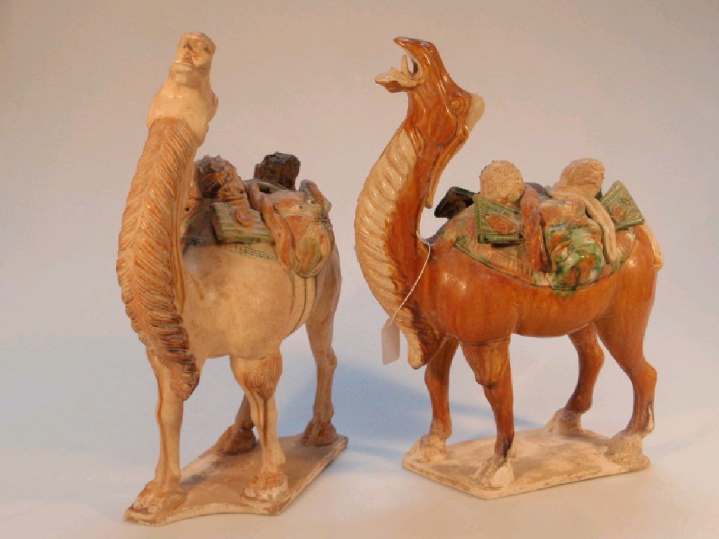 Appraisal: A matched pair of Chinese T'ang style terracotta camels standing