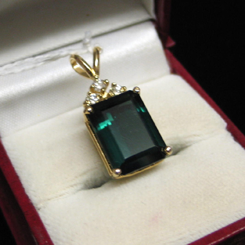 Appraisal: GREEN TOURMALINE DIAMOND AND FOURTEEN KARAT GOLD PENDANT set with