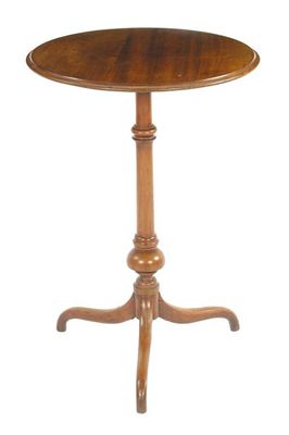 Appraisal: A mahogany tripod table the circular moulded edge top on