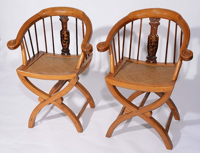 Appraisal: A pair of Chinese nanwood Ming style armchairseach with rattan