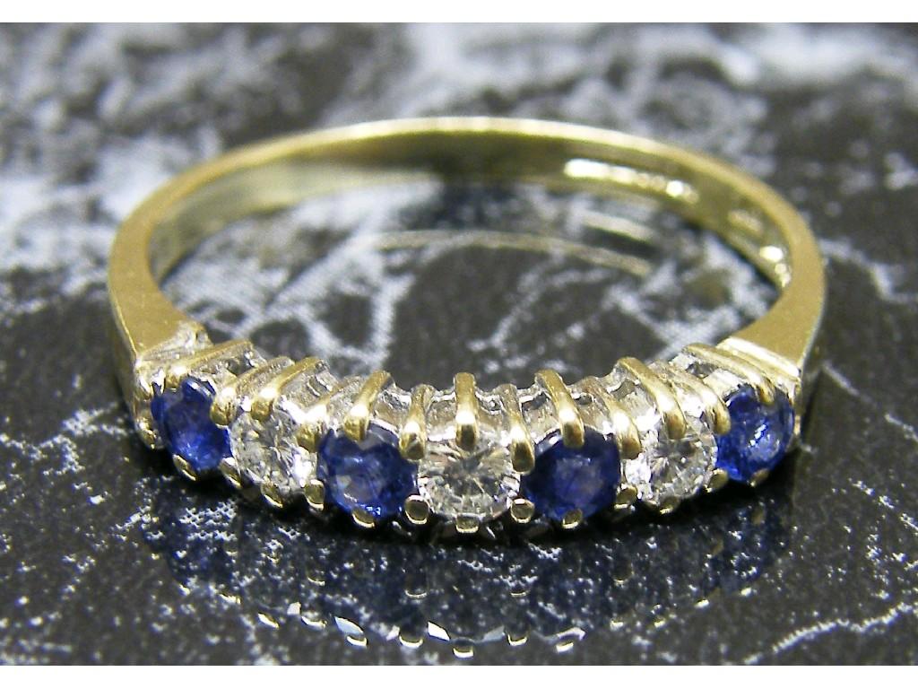 Appraisal: ct diamond and cornflower sapphire seven stone ring ct size