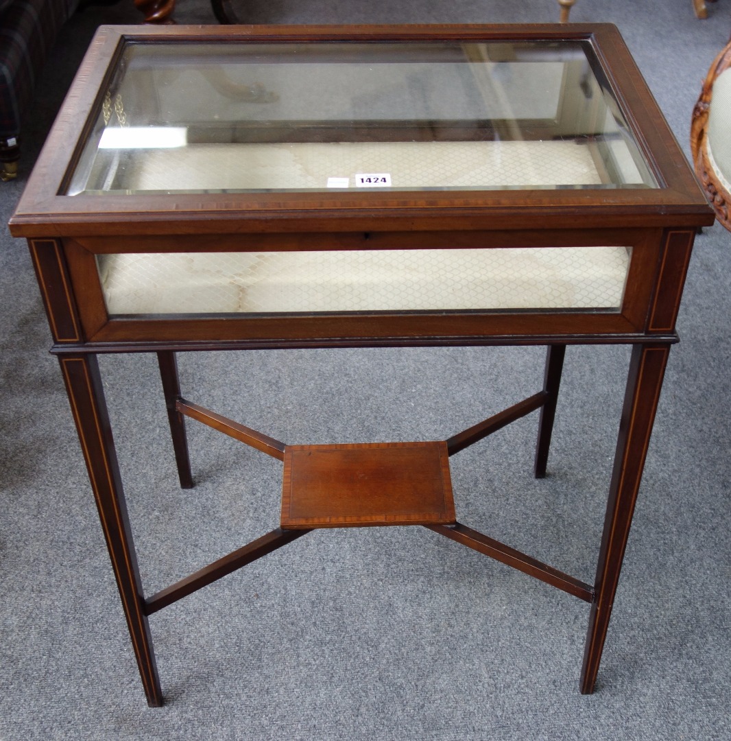 Appraisal: An Edwardian inlaid mahogany rectangular vertu table on tapering square