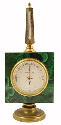 Appraisal: A French desk aneroid barometer and thermometer set in malachite