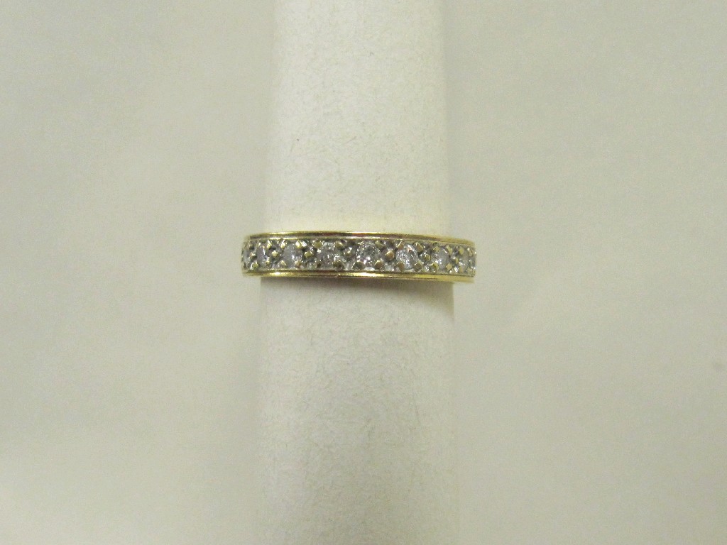 Appraisal: Eighteen carat yellow gold full hoop diamond eternity ring