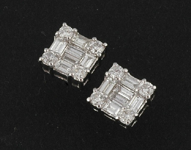 Appraisal: A PAIR OF DIAMOND EARRINGS Each square panel set with