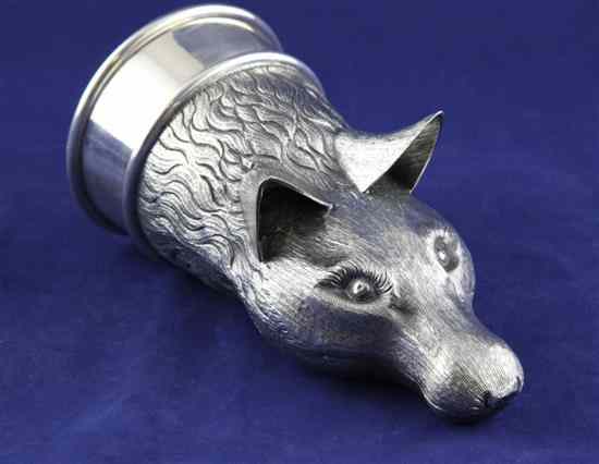 Appraisal: A mid 's silver fox head stirrup cup with textured