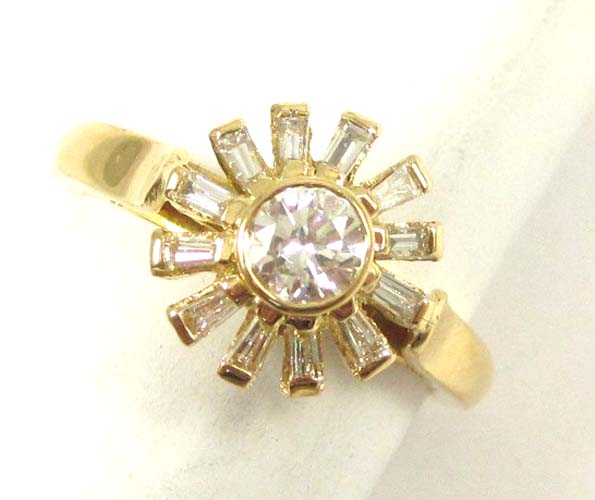 Appraisal: DIAMOND AND FOURTEEN KARAT GOLD RING with twelve baguette-cut diamonds