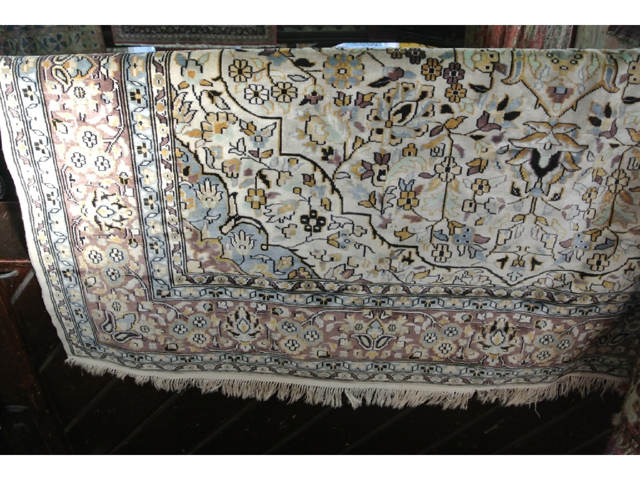 Appraisal: A Persian style rug with off white field abstract floral