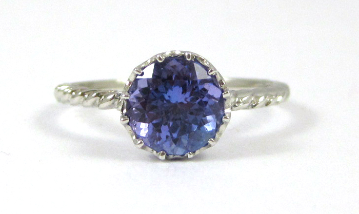 Appraisal: TANZANITE AND FOURTEEN KARAT GOLD SOLITAIRE RING The white gold