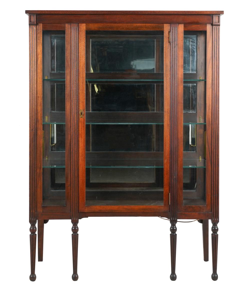 Appraisal: GLAZED MAHOGANY BOOKCASEwith fluted stiles and legs the hinged doors