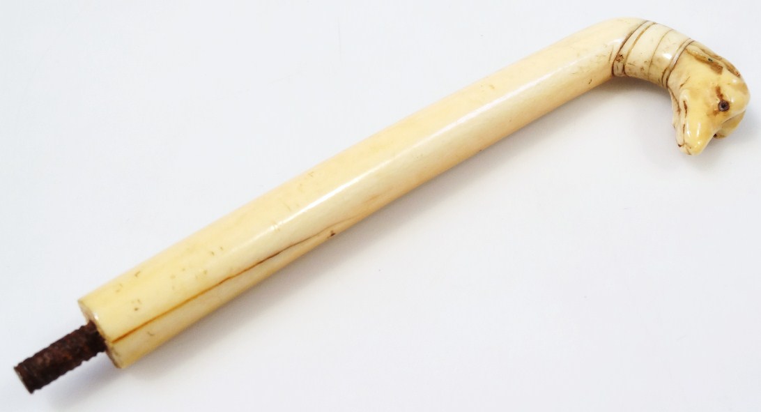 Appraisal: A thC carved ivory umbrella or stick handle in the