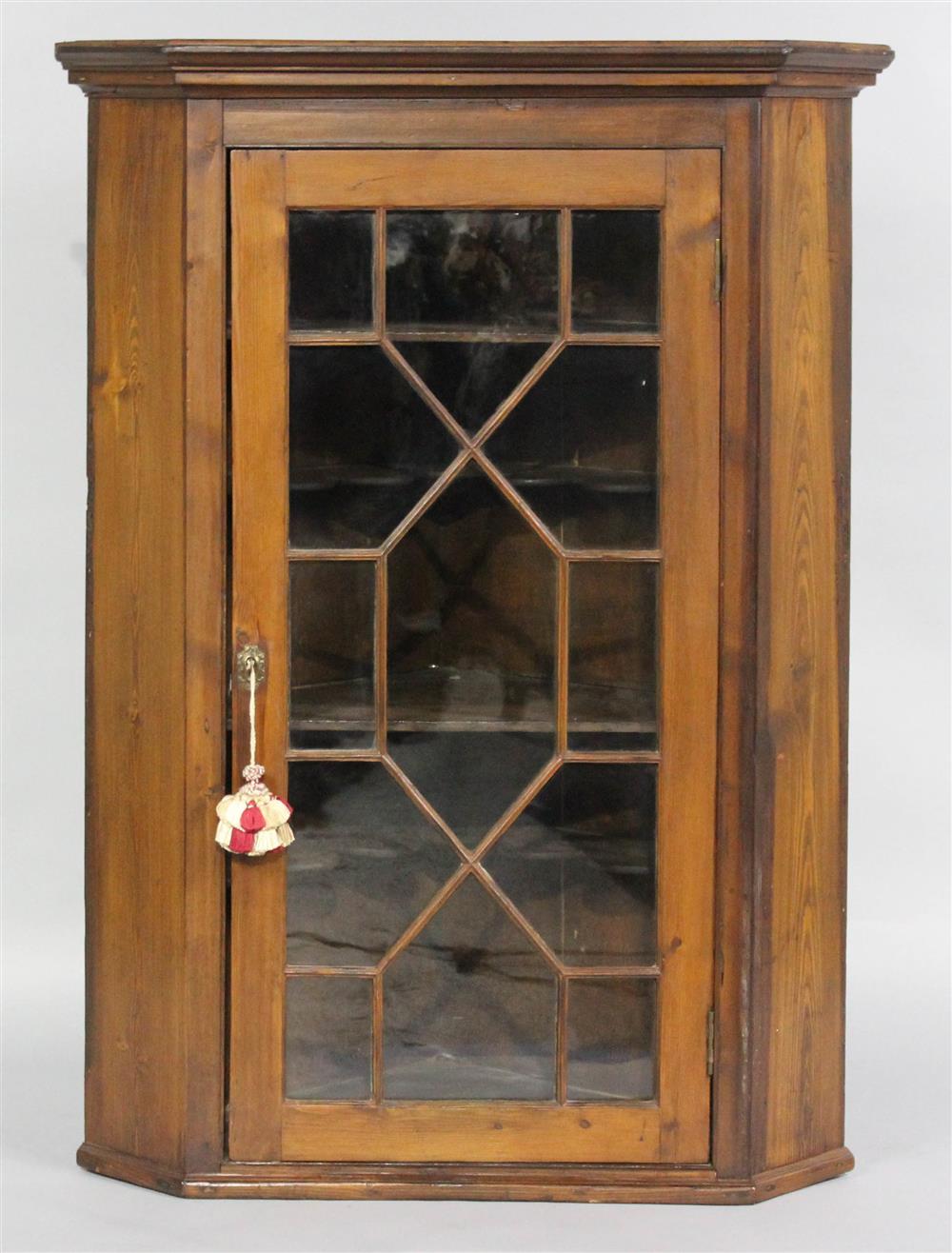 Appraisal: SOUTHERN YELLOW PINE HANGING CORNER CUPBOARD having a molded and