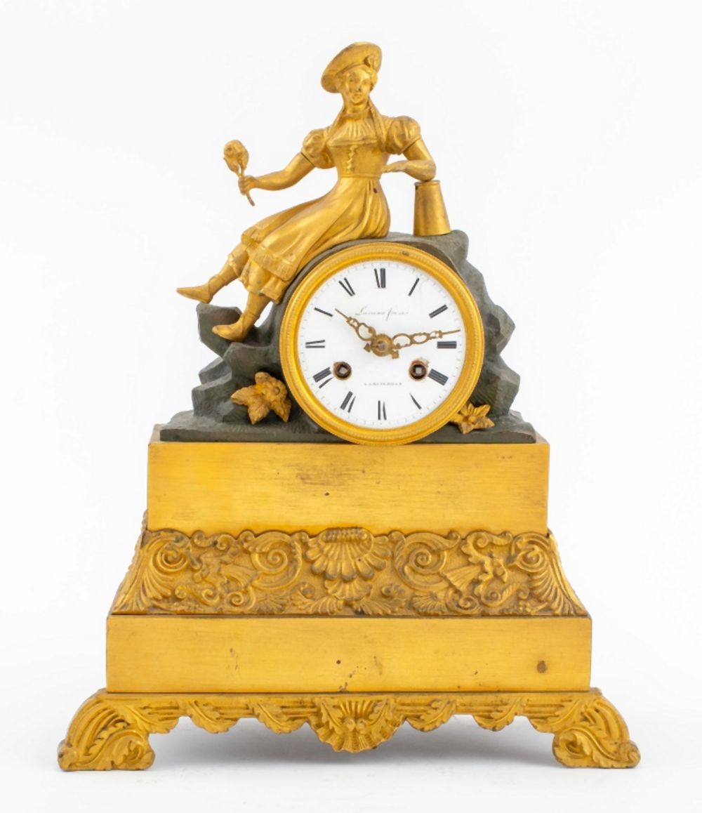 Appraisal: LOUIS PHILIPPE ORMOLU AND PATINATED BRONZE CLOCK Louis Philippe gilded