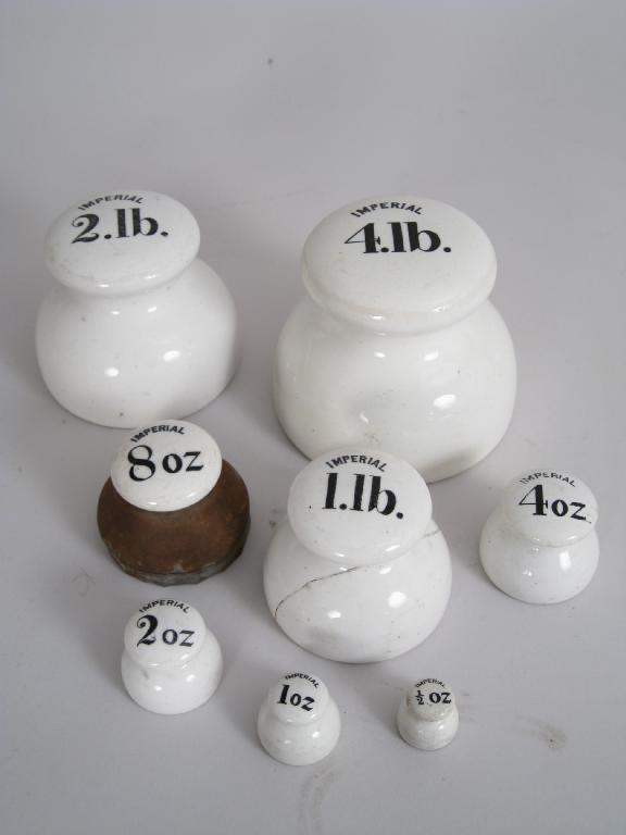 Appraisal: A Set of eight white ceramic Imperial Weights from oz