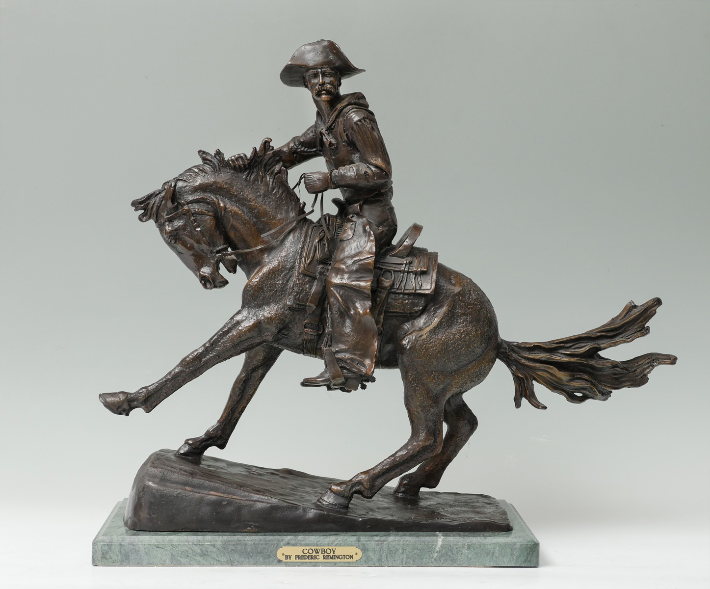 Appraisal: COWBOY BRONZE AFTER REMINGTON Bronze Grouping Depicts a Cowboy on