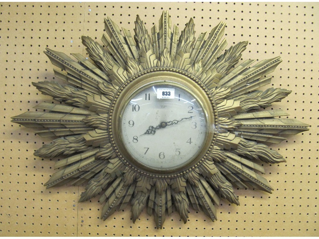 Appraisal: Smith electric sunburst style wall clock