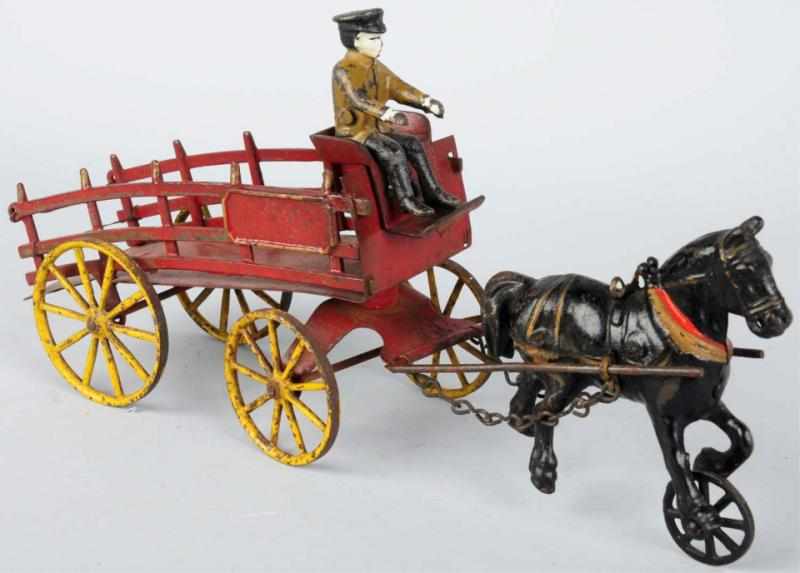 Appraisal: Cast Iron Harris Horse-Drawn Hay Wagon Toy American Comes with