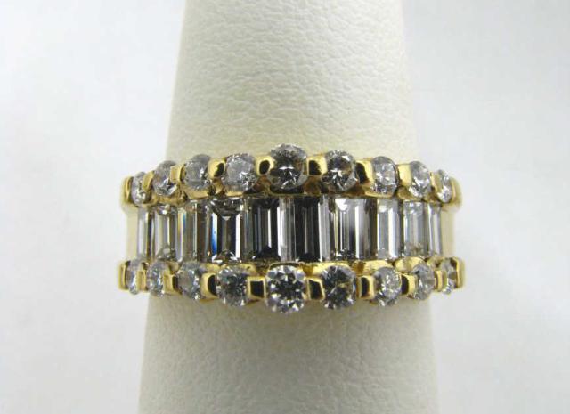 Appraisal: k yellow gold ctw diamond baguette and round diamond band