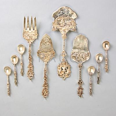 Appraisal: CAST SILVER ORNAMENTAL UTENSILS th C Sterling and rococo pastry