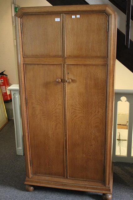 Appraisal: A HEAL SON LIMED OAK WARDROBE with plain interior a