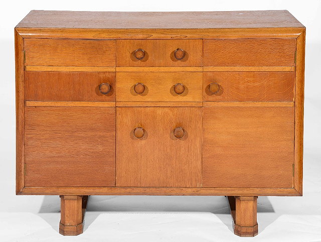 Appraisal: A Heals oak sideboardfrom The Economy Range with two short