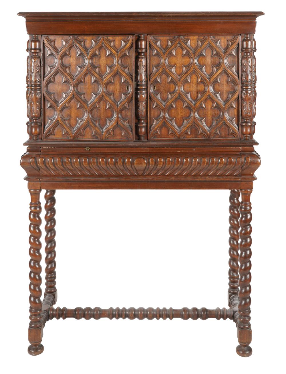 Appraisal: GOTHIC REVIVAL-STYLE CARVED OAK CABINET ON STANDin two parts Provenance