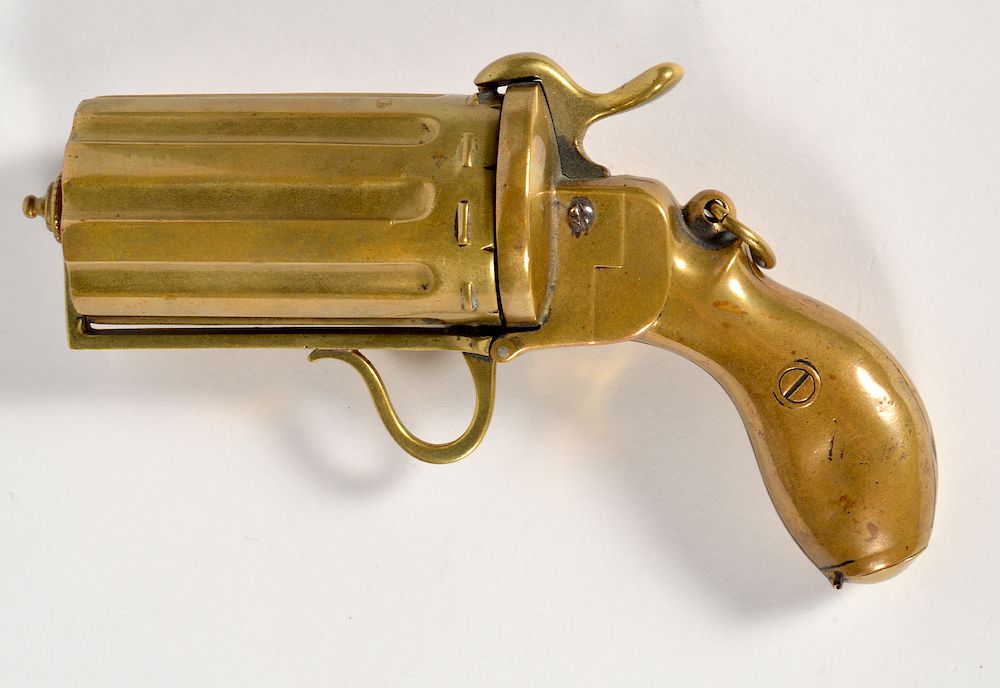 Appraisal: Unusual Brass Pistol Cigarette and Match Case French brass revolver