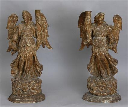 Appraisal: PAIR OF ITALIAN BAROQUE CARVED WOOD ANGEL-FORM PRICKET STICKS MOUNTED