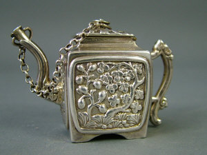 Appraisal: A George IV miniature silver teapot Birmingham of square form