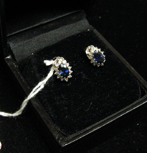 Appraisal: PAIR OF SAPPHIRE DIAMOND AND FOURTEEN KARAT WHITE GOLD EAR