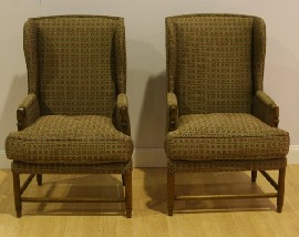 Appraisal: A pair of wingback oak chairs