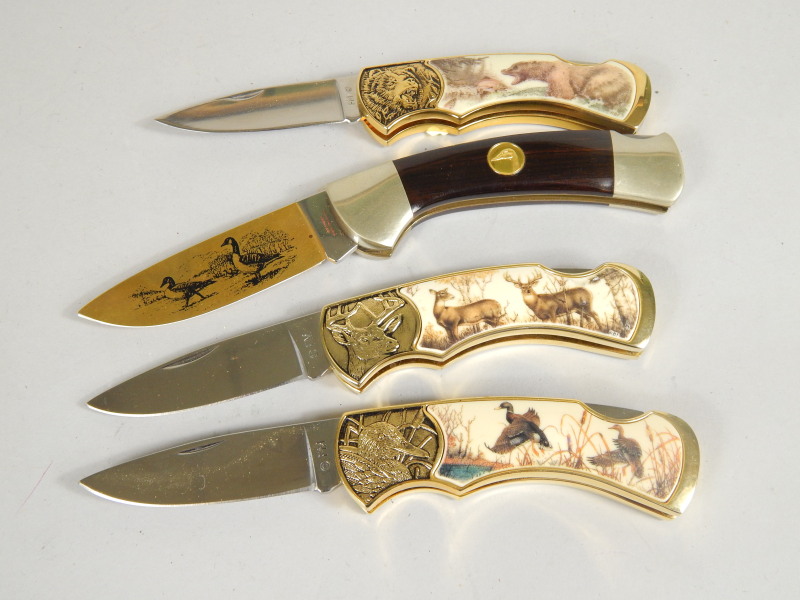 Appraisal: Three Franklin Mint hunting knives with retractable blade and another