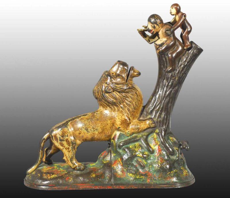 Appraisal: Cast Iron Lion Monkeys Mechanical Bank Description Manufactured by Kyser