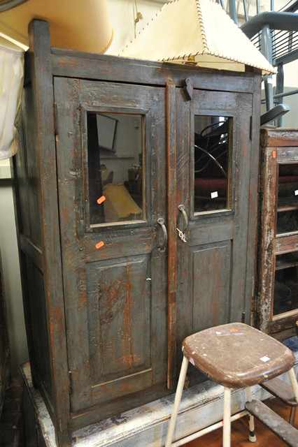 Appraisal: A DISTRESSED PAINTED GLAZED DOOR CABINET