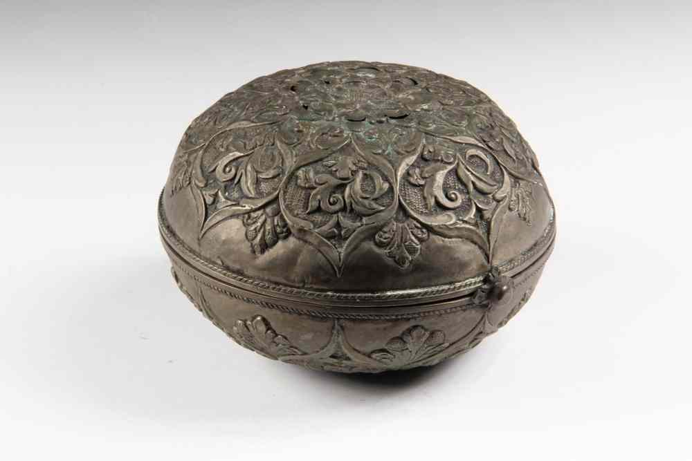 Appraisal: LIDDED ISLAMIC SILVER BOX-with overall repousse foliate decoration Hinge detached