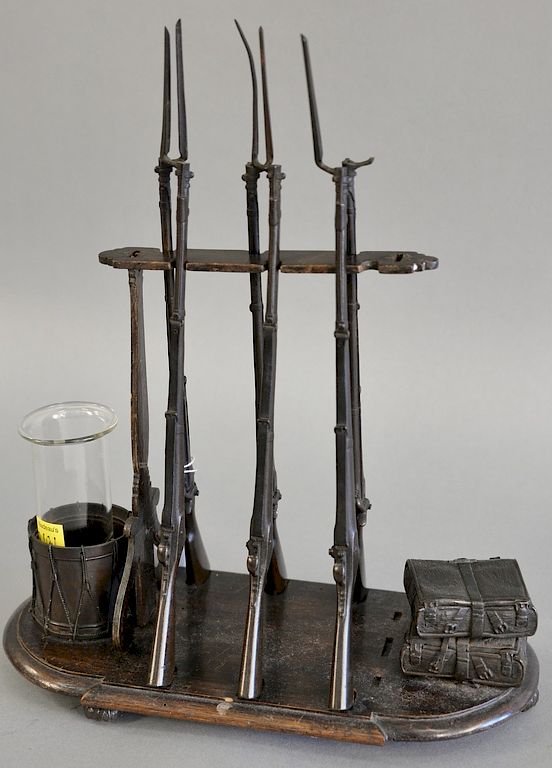 Appraisal: A French bronze desk ornament modeled as a gun rack