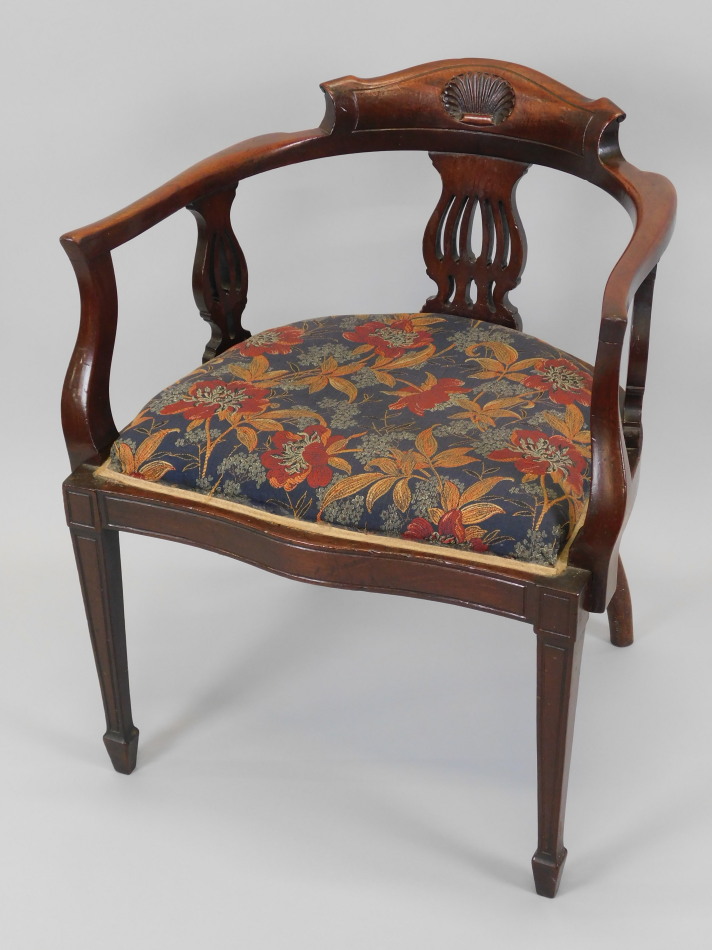 Appraisal: An Edwardian mahogany tub shaped chair with shaped back pierced