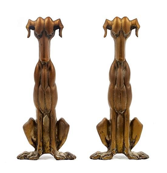 Appraisal: A Pair of Bronze Andirons depicting Stylized Dogs Height inches