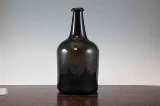 Appraisal: A large th century black glass wine bottle of mallet