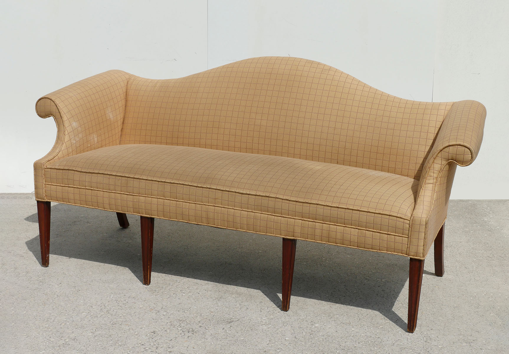 Appraisal: CAMEL BACK SOFA Checkered upholstery tapered leg framework Approx ''