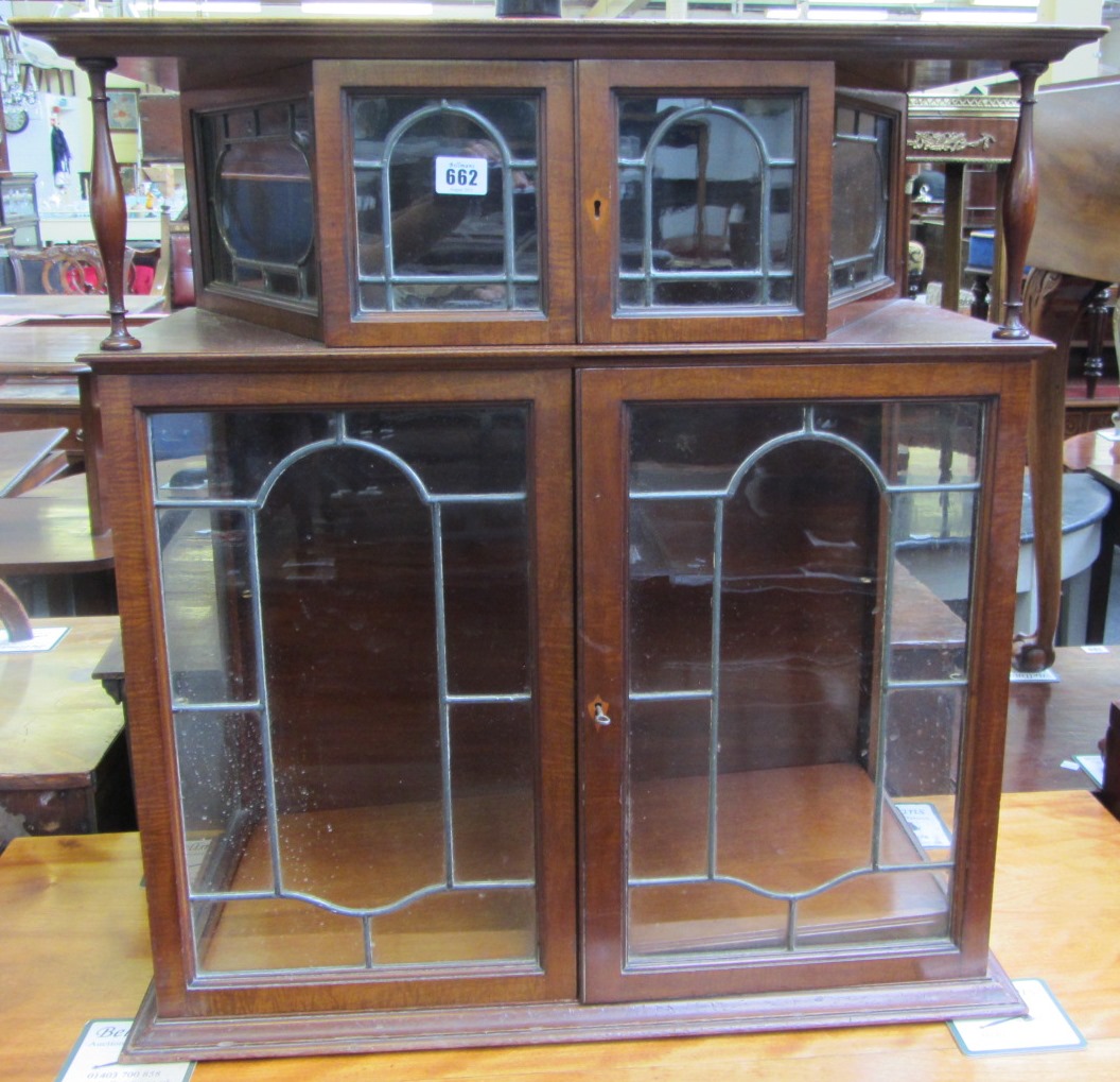 Appraisal: A late th century mahogany double section display cabinet with